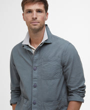 Load image into Gallery viewer, Model wearing Barbour Callercove Seersucker Overshirt in Vintage Teal.
