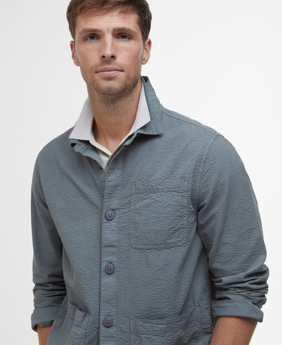 Model wearing Barbour Callercove Seersucker Overshirt in Vintage Teal.