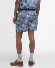 Load image into Gallery viewer, Model wearing Barbour Willowbeach Swim Short in Navy - back.
