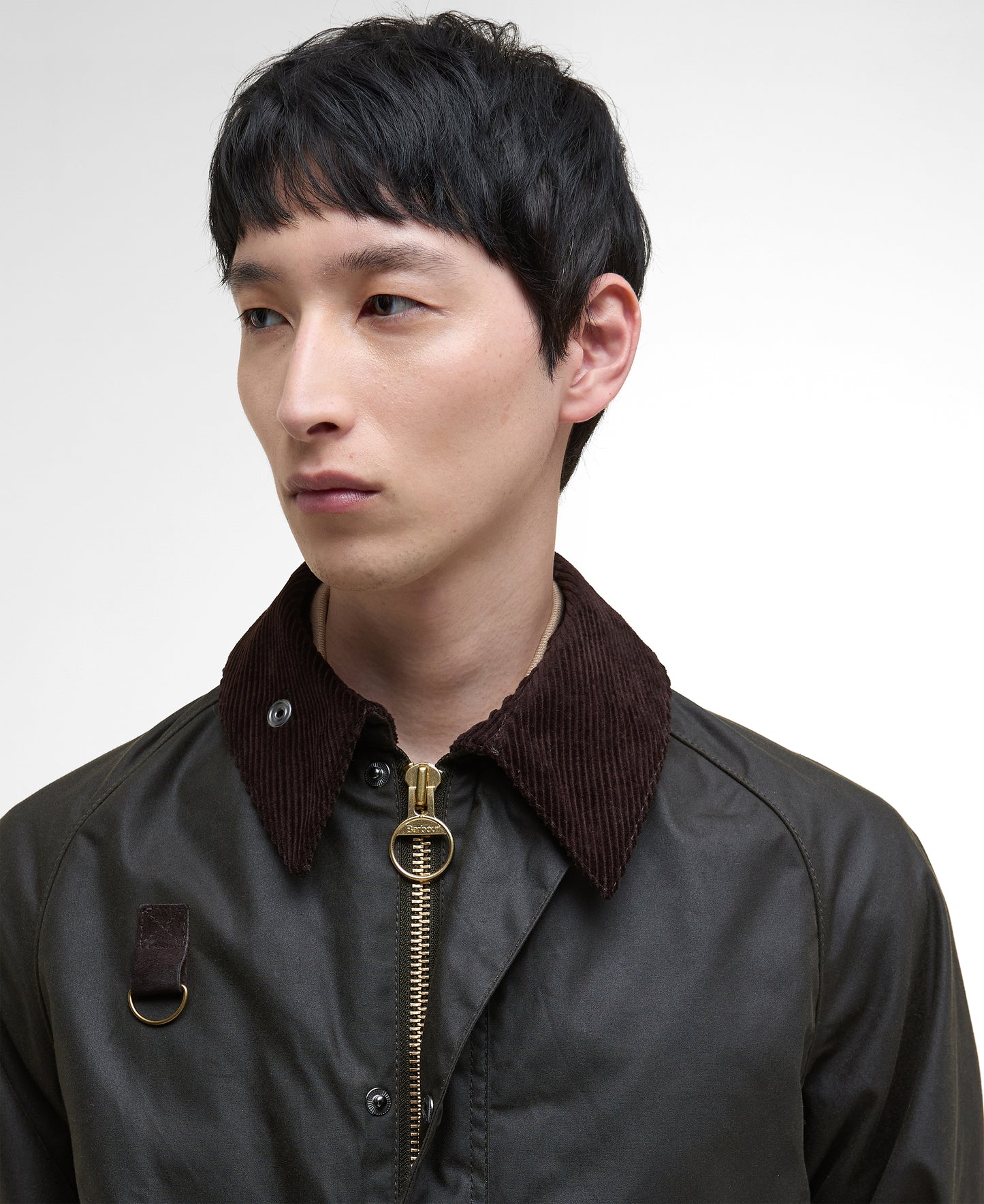 Model wearing Barbour Spey Wax Jacket in Olive. 
