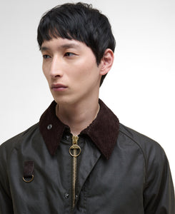 Model wearing Barbour Spey Wax Jacket in Olive. 