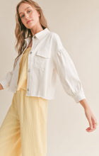 Load image into Gallery viewer, Model wearing Sadie &amp; Sage - No Stress Puff Sleeve Denim Jacket in White.
