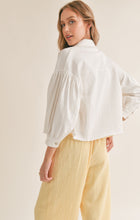 Load image into Gallery viewer, Model wearing Sadie &amp; Sage - No Stress Puff Sleeve Denim Jacket in White - back.
