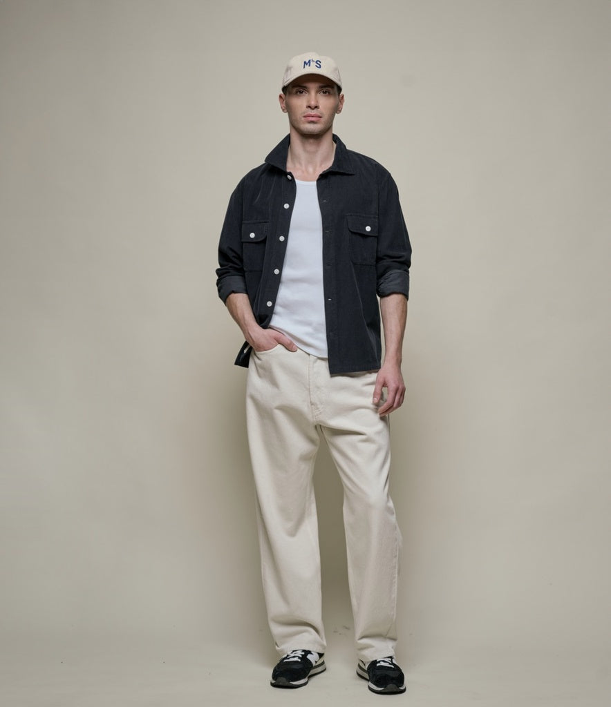 Model wearing Merz B. Schwanen - Good Basics Corduroy Overshirt in Deep Black.