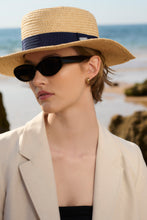 Load image into Gallery viewer, Model wearing Barbour Lily Straw Summer Hat in Natural/Navy.
