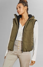 Load image into Gallery viewer, Model wearing Alp N Rock - Sonja Reversible Short Vest in Dark Moss.
