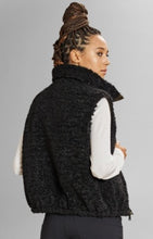 Load image into Gallery viewer, Model wearing Alp N Rock - Sonja Reversible Short Vest in Dark Moss.
