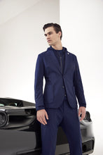 Load image into Gallery viewer, Model wearing TMB - Performance Travel Suit in Navy.
