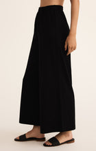 Load image into Gallery viewer, Model wearing ZSupply - Scout Jersey Pant in Black.
