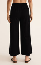 Load image into Gallery viewer, Model wearing ZSupply - Scout Jersey Pant in Black - back.
