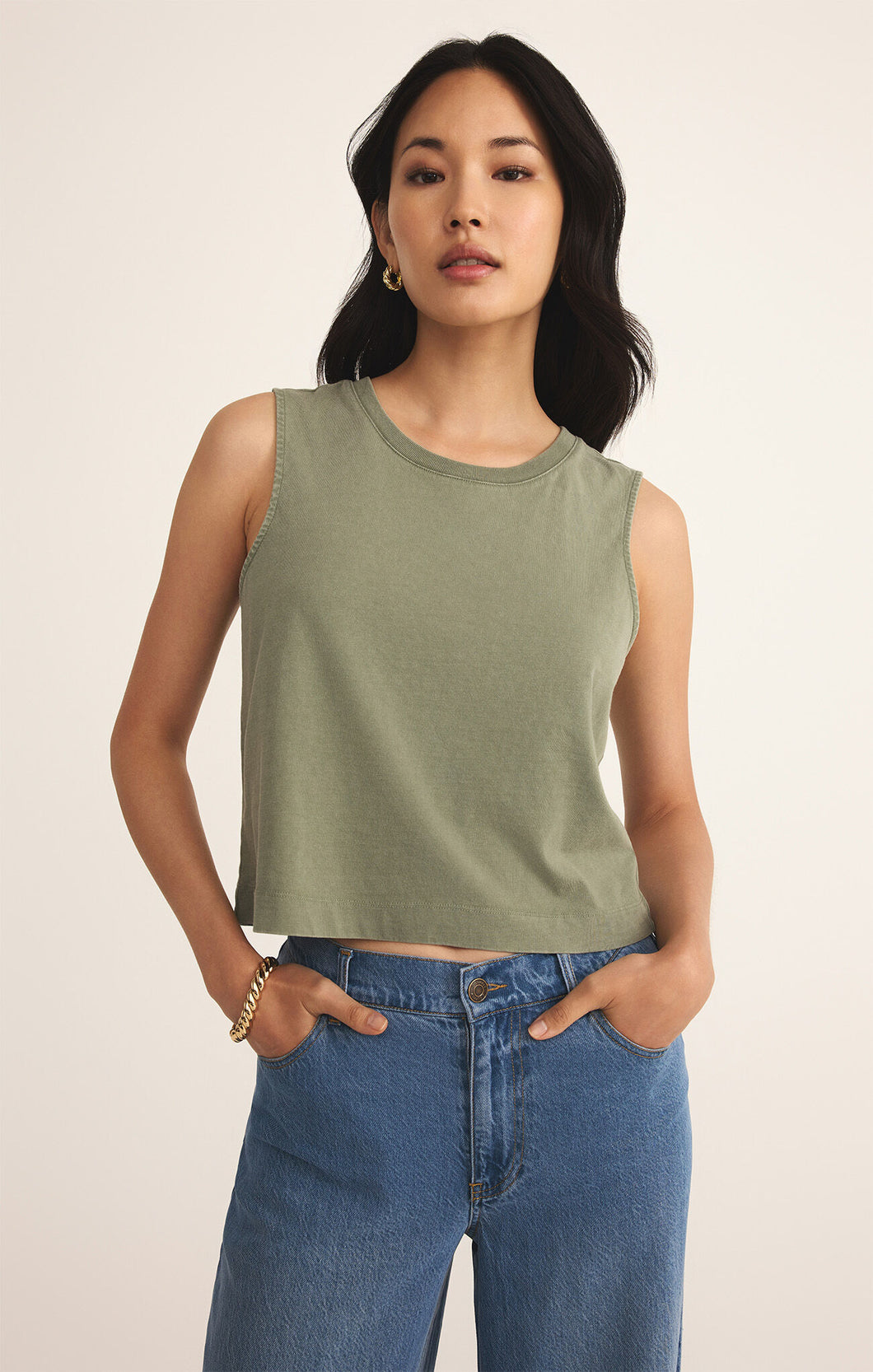 Model wearing ZSupply - Sloane Jersey Muscle Tank in Avocado.