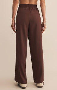 Model wearing ZSupply Saunder Track Pant in Sandalwood - back.