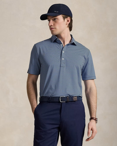 Model wearing RLX - Ralph Lauren Classic Fit Performance Polo Shirt in Refined Navy/Austin Blue.