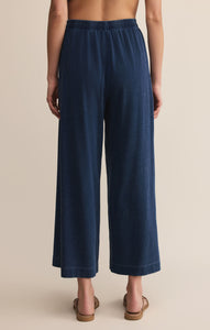 Model wearing ZSupply - Scout Jersey Pant in Indigo -back.