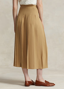 Model wearing Polo Ralph Lauren - Satin Pleated A-Line Midi Skirt in Camel - back.
