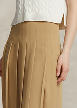 Load image into Gallery viewer, Model wearing Polo Ralph Lauren - Satin Pleated A-Line Midi Skirt in Camel.
