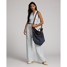 Load image into Gallery viewer, Model wearing RRL - Large Cotton/Jute/Leather Beach Bag in Indigo/Brown.

