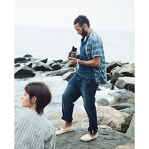 Model wearing RRL - Indigo Striped Jersey Camp Shirt in Indigo Multi.