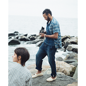 Model wearing RRL - Indigo Striped Jersey Camp Shirt in Indigo Multi.