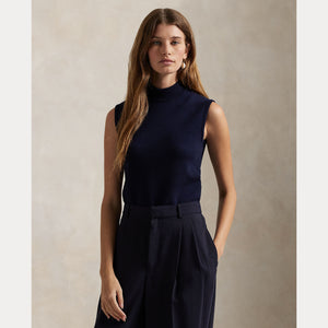 Model wearing Polo Ralph Lauren - Sleeveless Turtleneck Sweater in Hunter Navy.