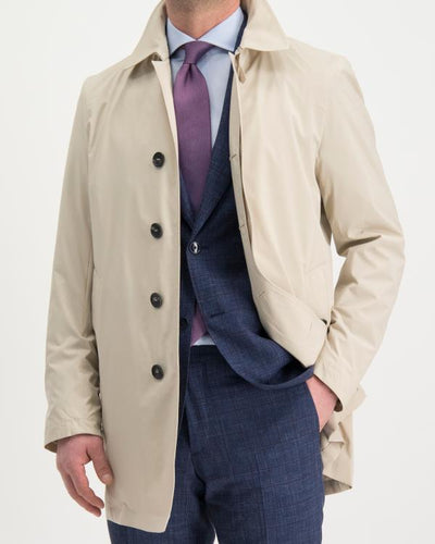 Model wearing Manto Bertram jacket in tan.