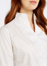 Load image into Gallery viewer, Model wearing Dubarry Snowdrop long sleeve button down shirt in white.
