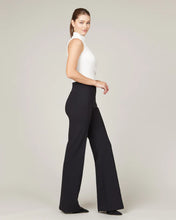 Load image into Gallery viewer, Model wearing Spanx - The Perfect Pant, Hi-Rise Flare in Classic Black 20252R.
