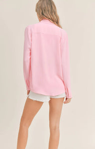 Model wearing Sadie & Sage - So Posh Button Down Shirt in Pink - back.