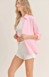 Model wearing Sadie & Sage - So Posh Button Down Shirt in Pink.