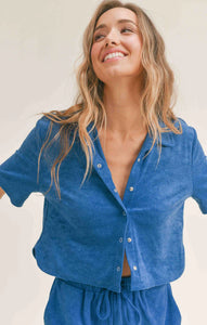 Model wearing Sadie & Sage - Pool Day Terry Crop Shirt in Blue.