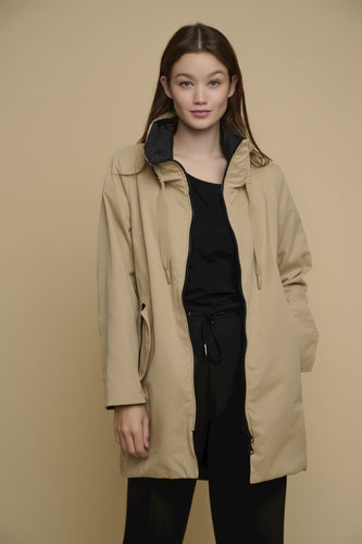Model wearing Rino & Pelle - Brazil Reversible Coat in Warm Sand & Black.