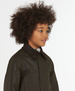 Model wearing Barbour Youth Beaufort Jacket in Olive.