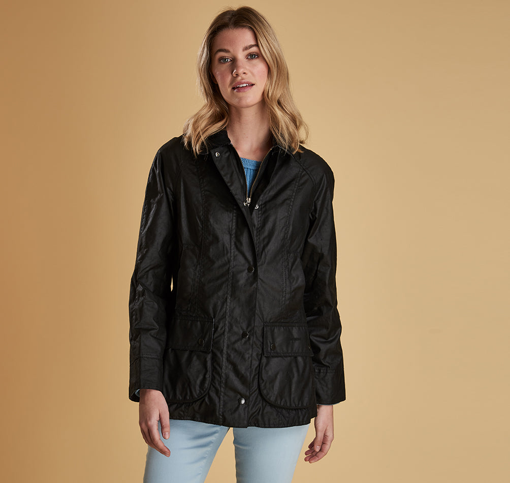 Model wearing Barbour Beadnell wax jacket in black.