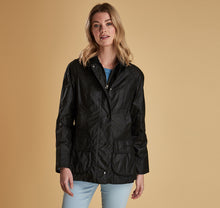 Load image into Gallery viewer, Model wearing Barbour Beadnell wax jacket in black.
