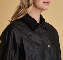 Load image into Gallery viewer, Model wearing Barbour Beadnell wax jacket in black.
