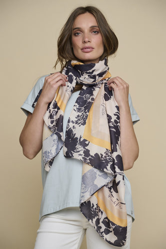 Model wearing Rino & Pelle - Lotis Scarf in Birch Bloom.