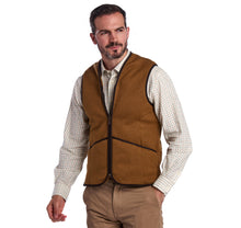 Load image into Gallery viewer, Model wearing Barbour Warm Pile Waistcoat Zip-In Liner in brown.
