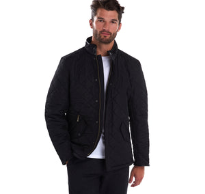Model wearing Barbour Powell Quilt jacket in black.