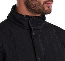 Load image into Gallery viewer, Model wearing Barbour Powell Quilt jacket in black.
