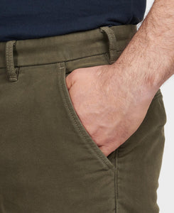 Model wearing Barbour Neuston Moleskin Pants in Dark Olive - pocket.