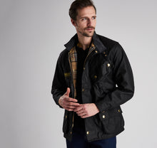 Load image into Gallery viewer, Model wearing Barbour International Original Jacket in black.
