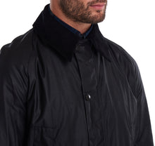 Load image into Gallery viewer, Model wearing a Barbour Ashby waxed jacket in black.
