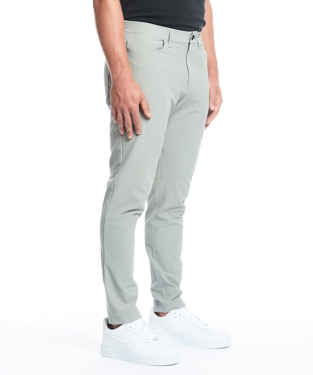 Model wearing Public Rec Workday Pant straight leg in fog.
