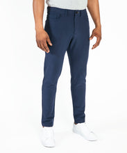 Load image into Gallery viewer, Model wearing Public Rec Workday Pant straight leg in navy.
