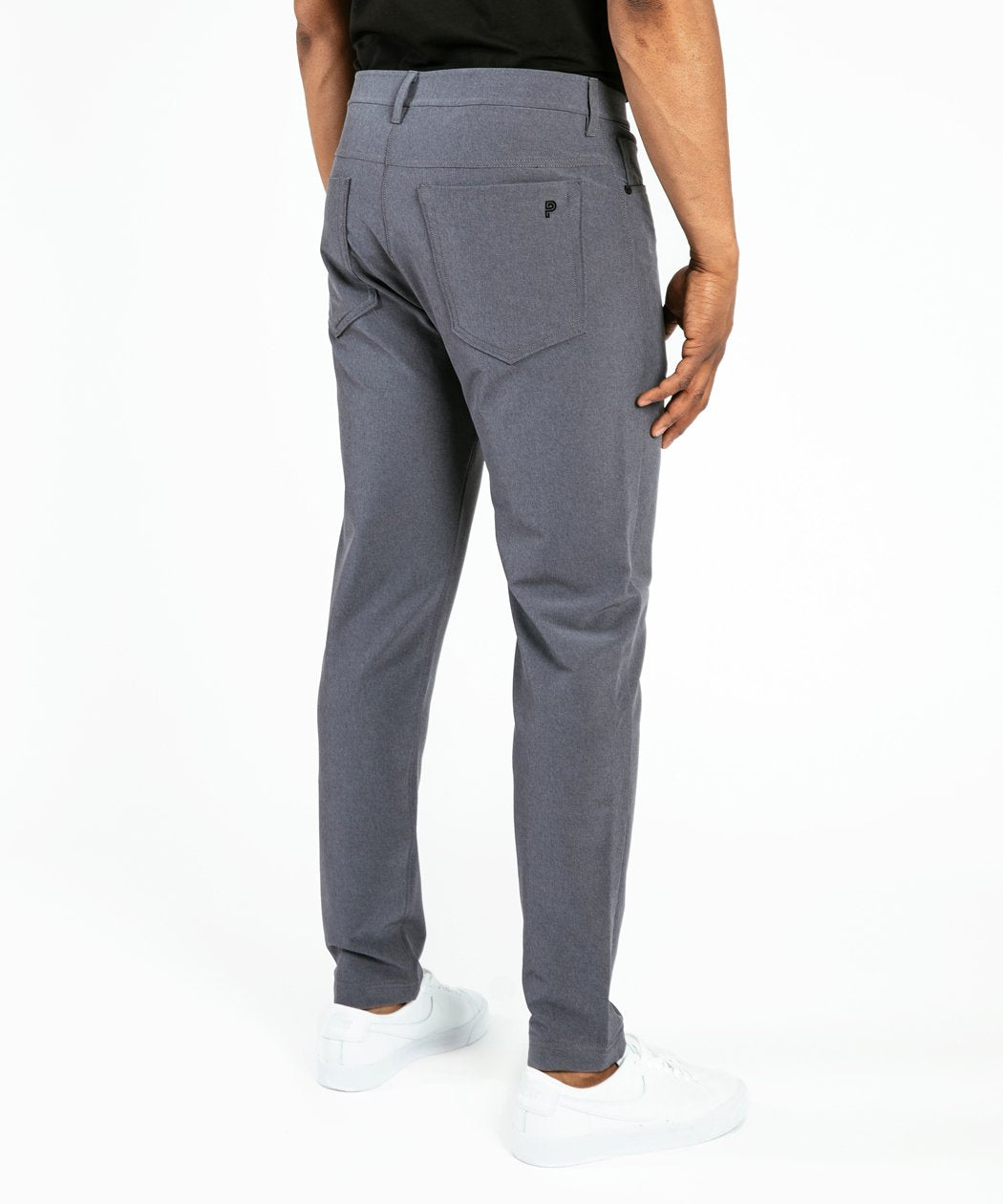 Model wearing Public Rec Workday Pant straight leg in slate.