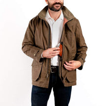 Load image into Gallery viewer, Model wearing Tom Beckbe Tensaw jacket in tobacco.
