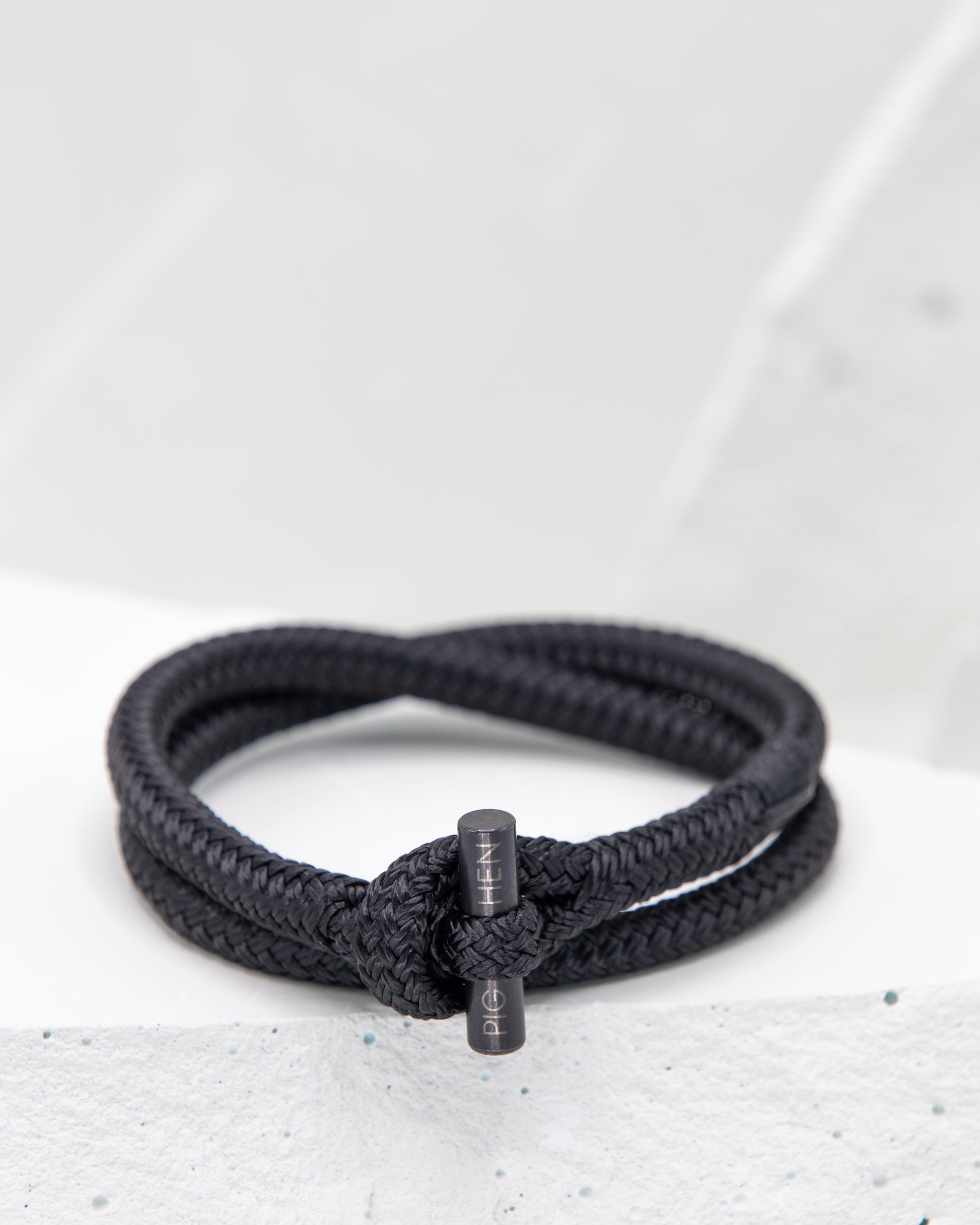 Pig & Hen Tiny Ted black with black buckle bracelet.