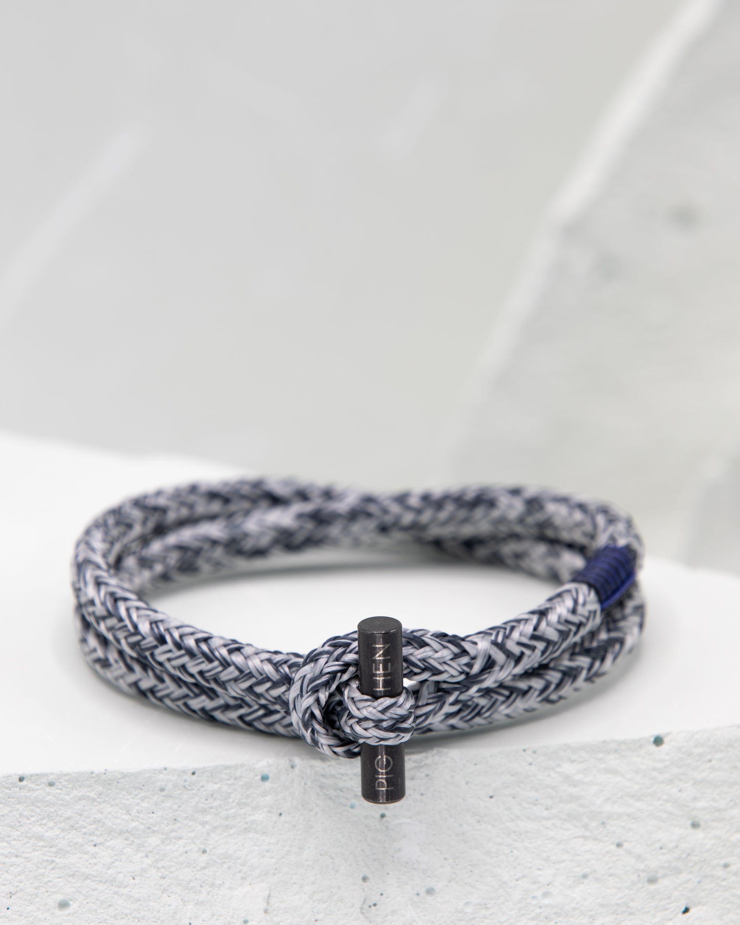 Pig & Hen Tiny Ted slate gray and light grace with black buckle bracelet.