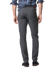 Load image into Gallery viewer, Model wearing Rodd &amp; Gunn Motion 2 Straight Jean RL Coal.
