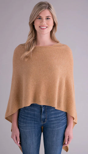 Model wearing Alashan - 100% Cashmere Dress Topper Poncho in Blonde Camel.